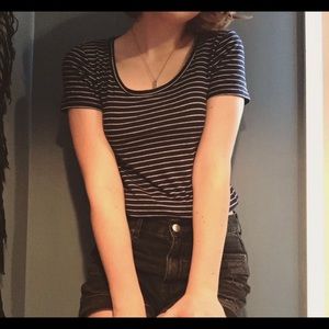 Navy and white swoop neck striped shirt.